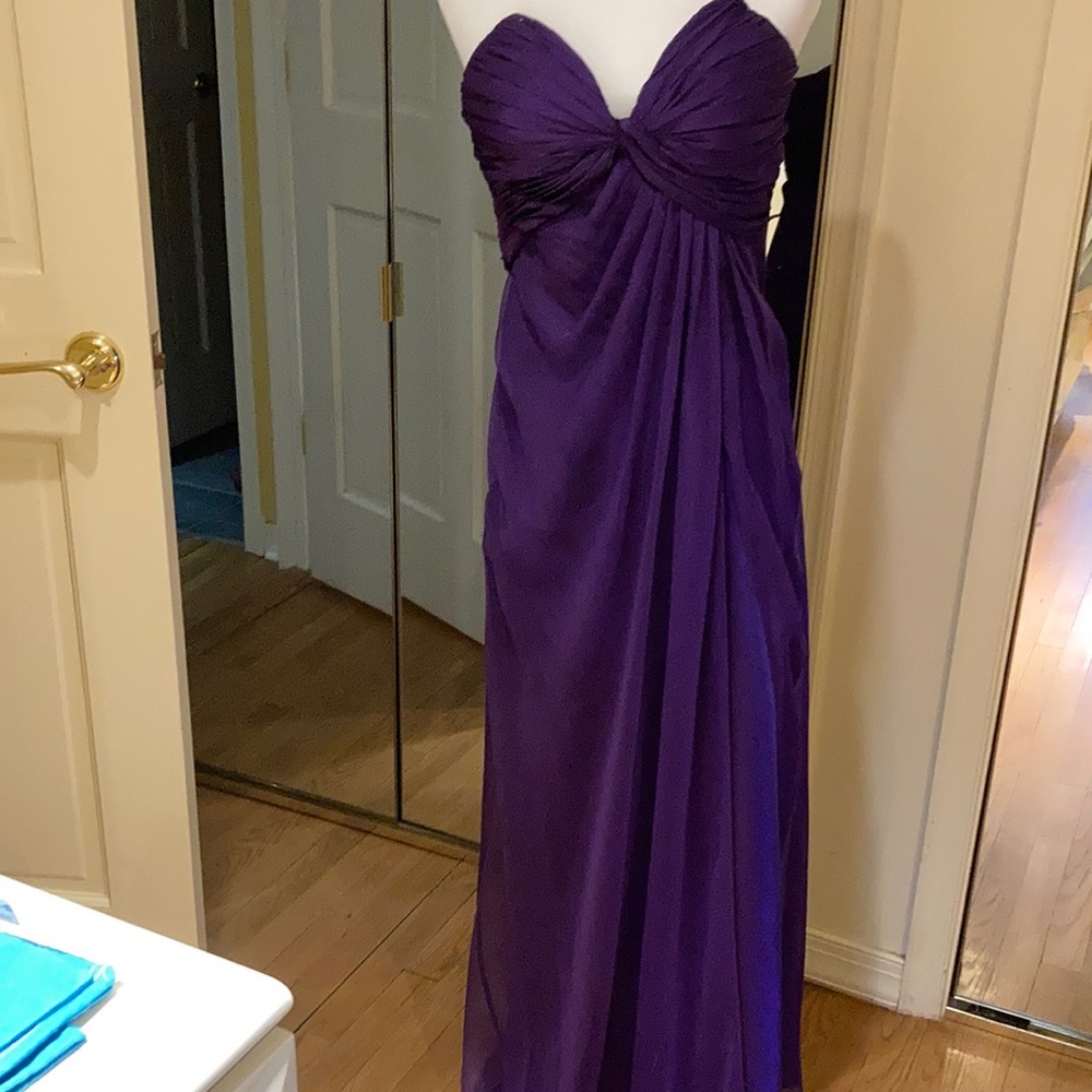 Purple gown with side slit.
